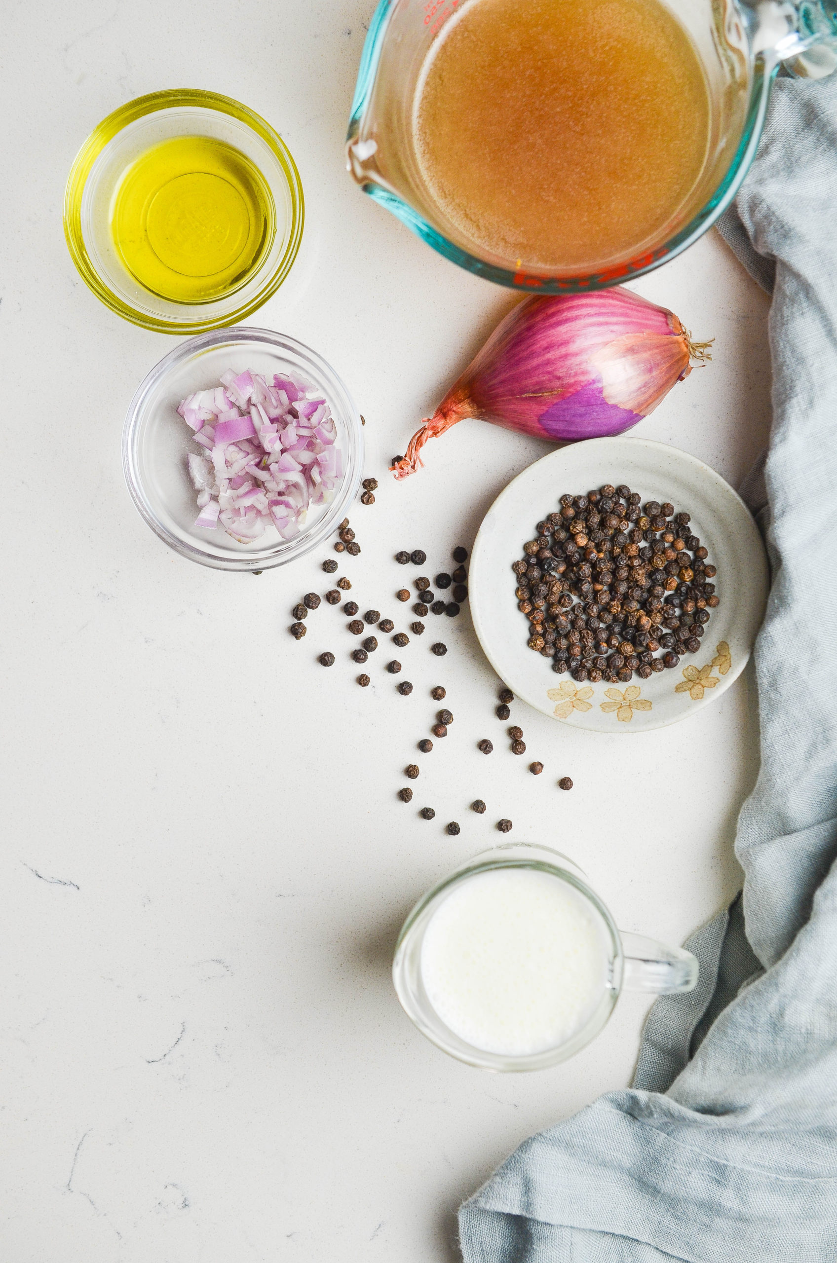 Overhead photo of ingredients on white surface. 