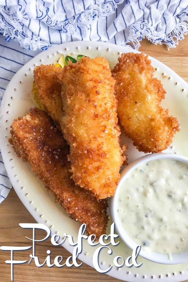 Fried Cod is our favorite fried fish. It's crispy on the outside and flaky on the inside. And it is perfect for dunking in homemade tartar sauce. #friedfish #friedcod #panko #seafood #dinner #familyfriendly 