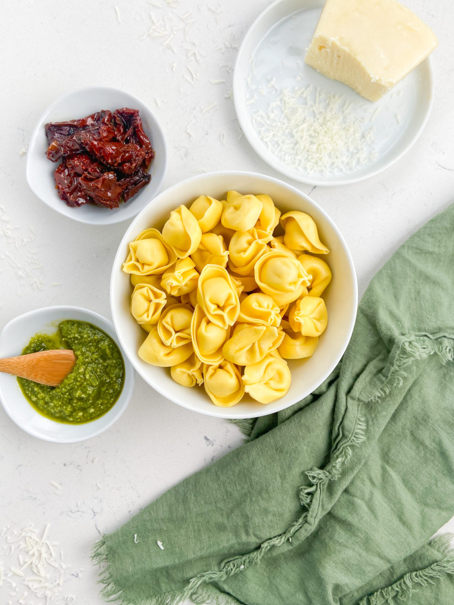 Pesto Tortellini Ingredients with a green napkin. 