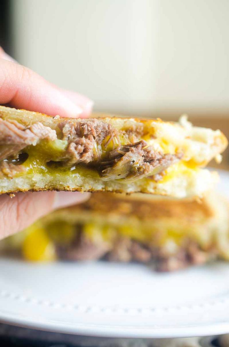 Pot Roast Grilled Cheese is THE BEST thing to do with your leftover Pot Roast. Loaded with cheddar, pot roast and pickles. It's leftover bliss!