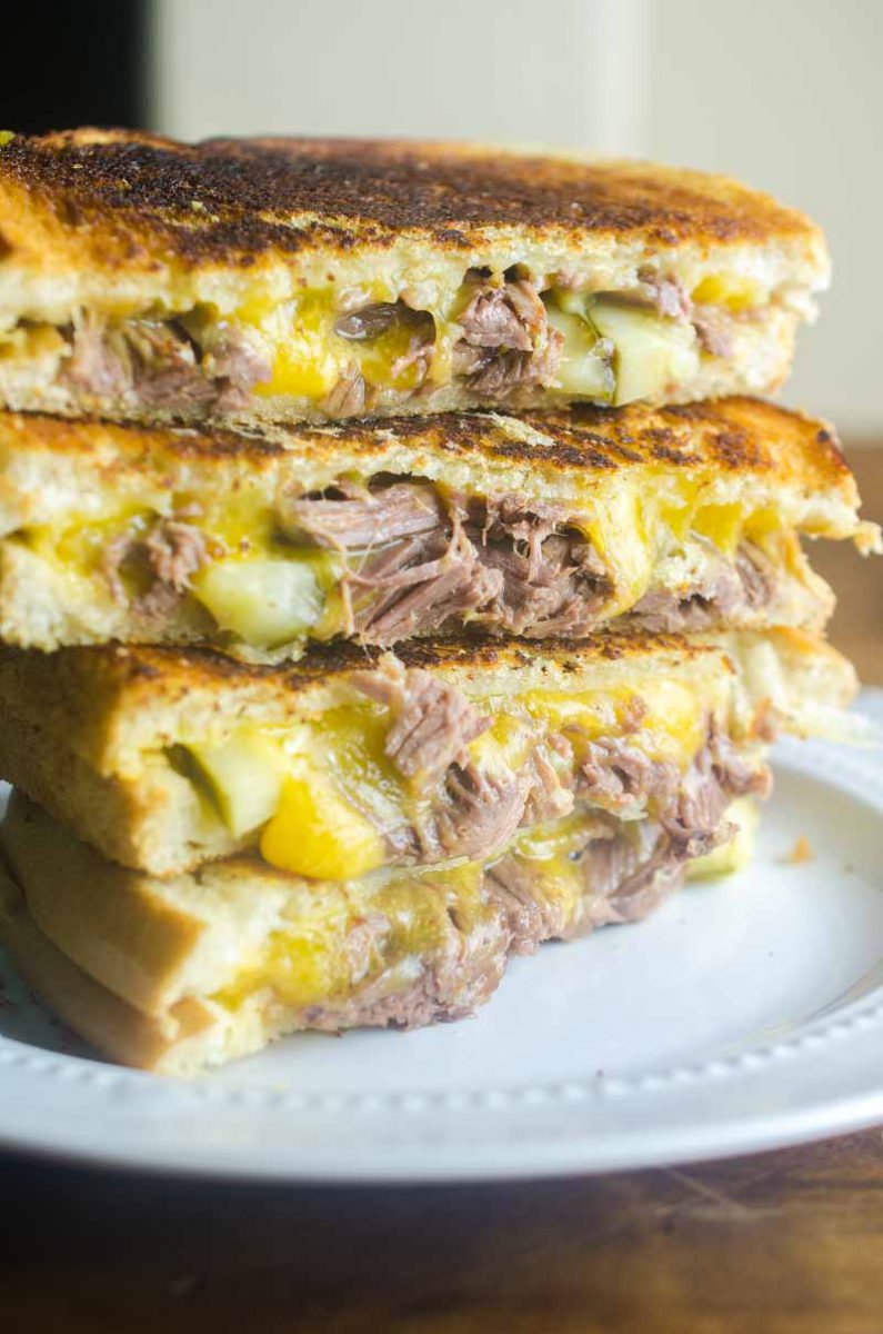 Pot Roast Grilled Cheese is THE BEST thing to do with your leftover Pot Roast. Loaded with cheddar, pot roast and pickles. It's leftover bliss!