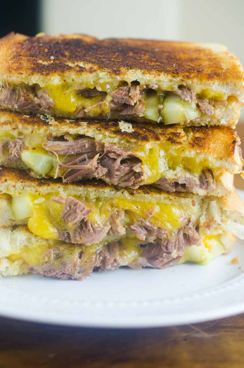 Pot Roast Grilled Cheese is THE BEST thing to do with your leftover Pot Roast. Loaded with cheddar, pot roast and pickles. It's leftover bliss!