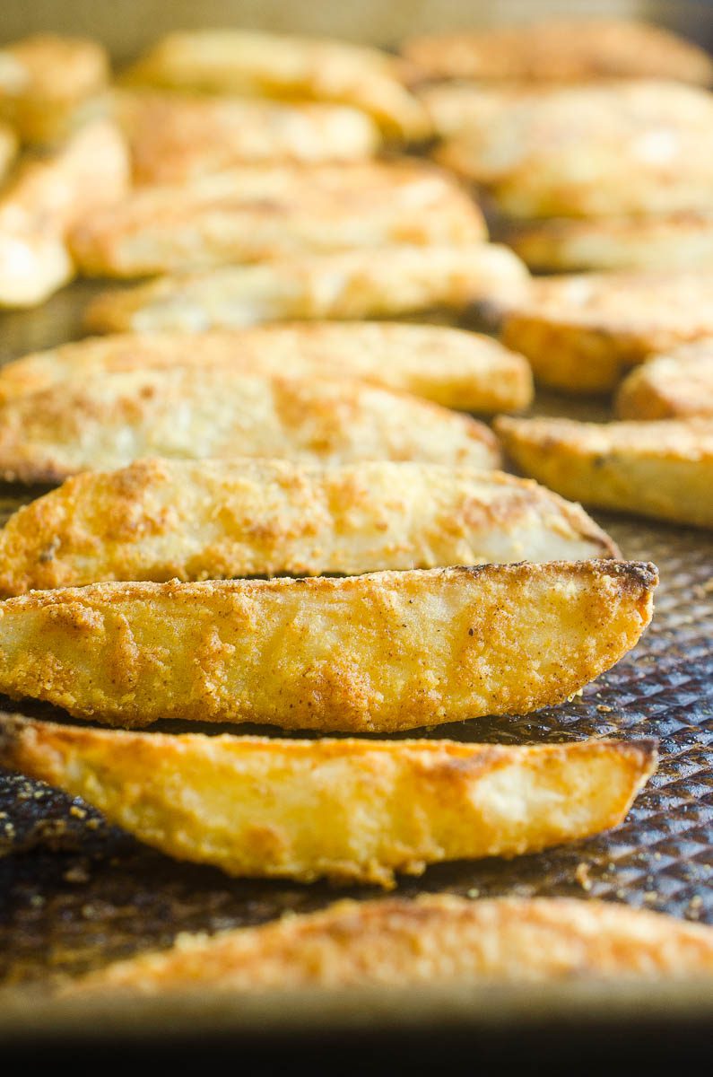 Potato wedges, or Jo Jo Potatoes as I like to call them, are perfectly seasoned and baked until golden.  Crispy on the outside and fluffy on the inside. They will be a hit with your whole family. 