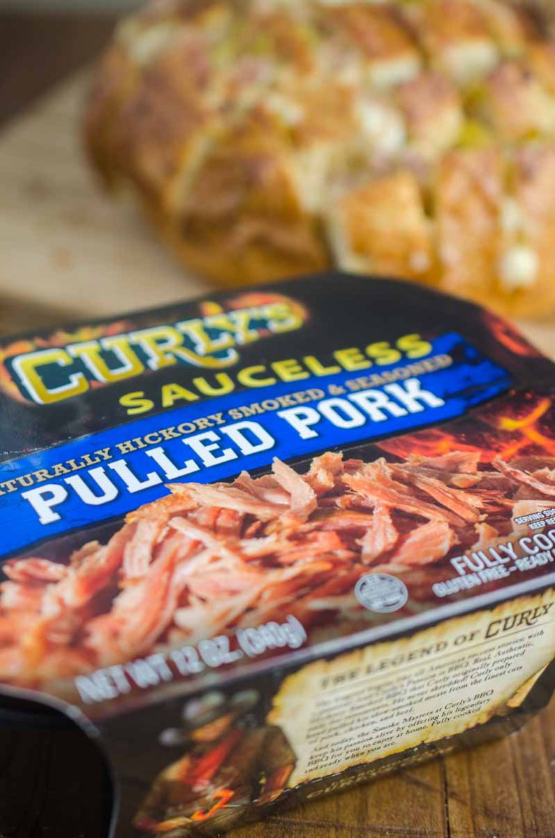  Pulled Pork Pull Apart Bread is loaded with delicious pulled pork, cheese, chiles and onions. It’s the perfect cheesy snack for game day!