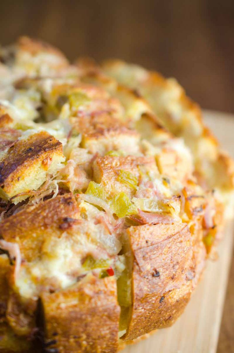 Pulled Pork Pull Apart Bread is loaded with delicious pulled pork, cheese, chiles and onions. It’s the perfect cheesy snack for game day!