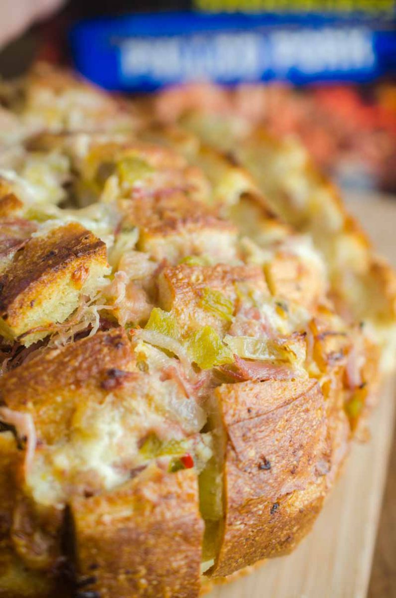  Pulled Pork Pull Apart Bread is loaded with delicious pulled pork, cheese, chiles and onions. It’s the perfect cheesy snack for game day!