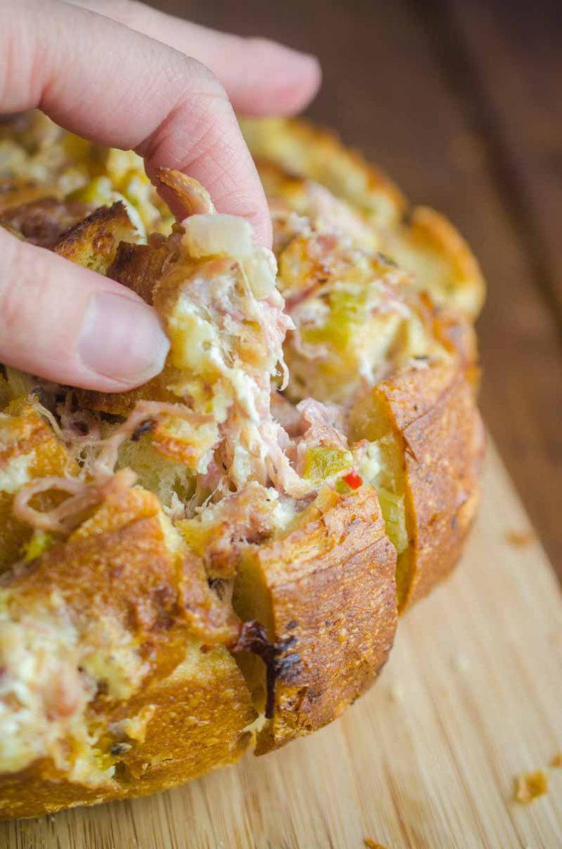  Pulled Pork Pull Apart Bread is loaded with delicious pulled pork, cheese, chiles and onions. It’s the perfect cheesy snack for game day!