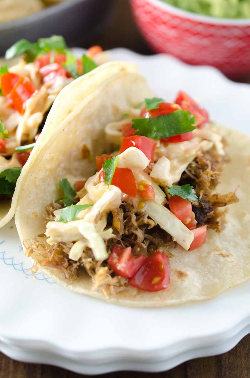 These Pulled Pork Tacos with Chipotle Slaw are packed full of flavor and a great addition to your Taco Tuesday! 