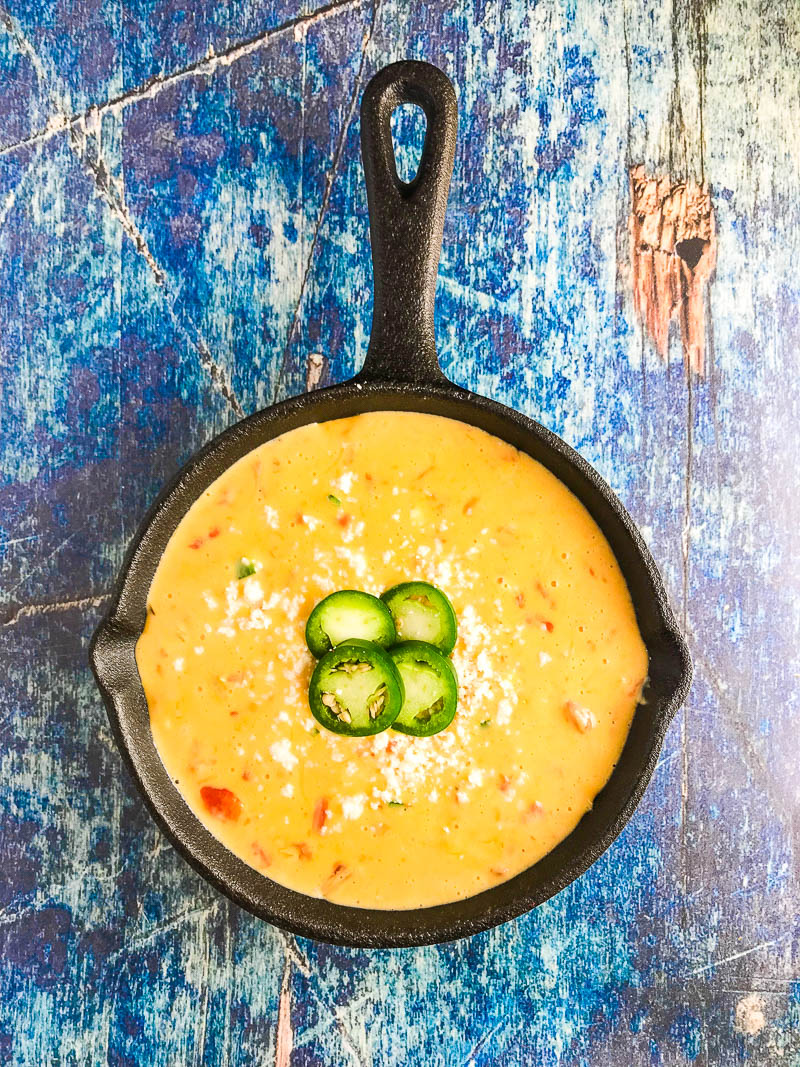 Queso Dip with Three Cheeses is a must for all of your tailgating, parties, summer BBQs. With Velveeta, pepper jack and cojita it's a creamy, cheese dip sure to be a hit