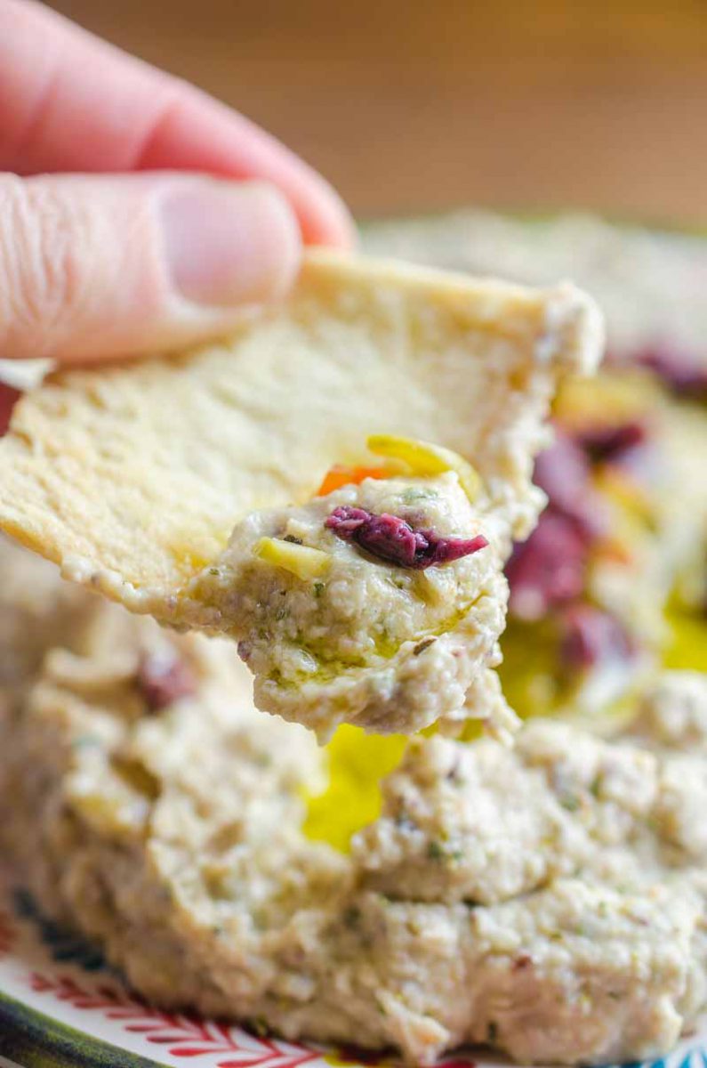 Quick olive hummus is a great twist on the classic snack. It's the perfect dip for parties or your afternoon snack session. 