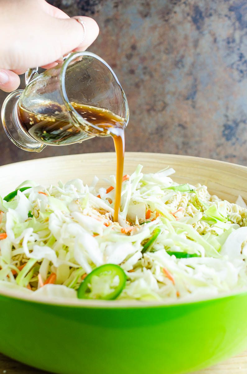 Pouring dressing on Ramen Noodle Salad