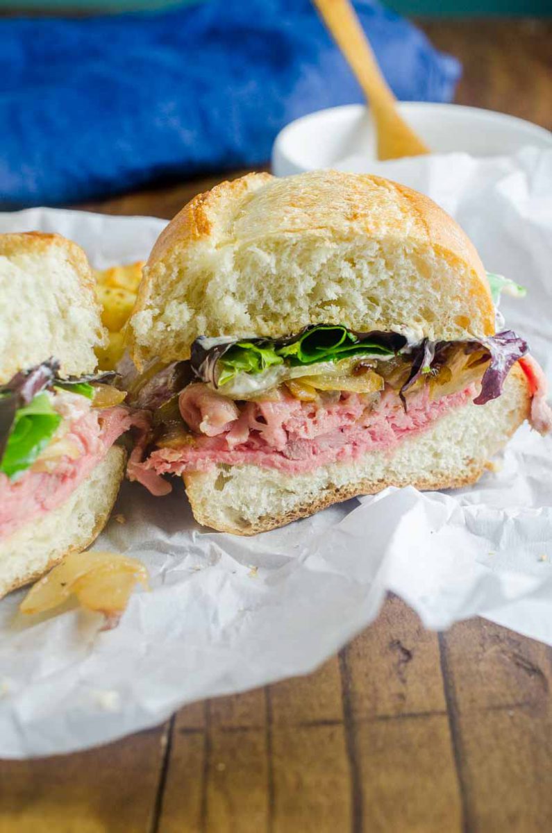 The Best Roast Beef Sandwich loaded with thinly sliced roast beef, caramelized onions, lettuce and a creamy horseradish sauce.