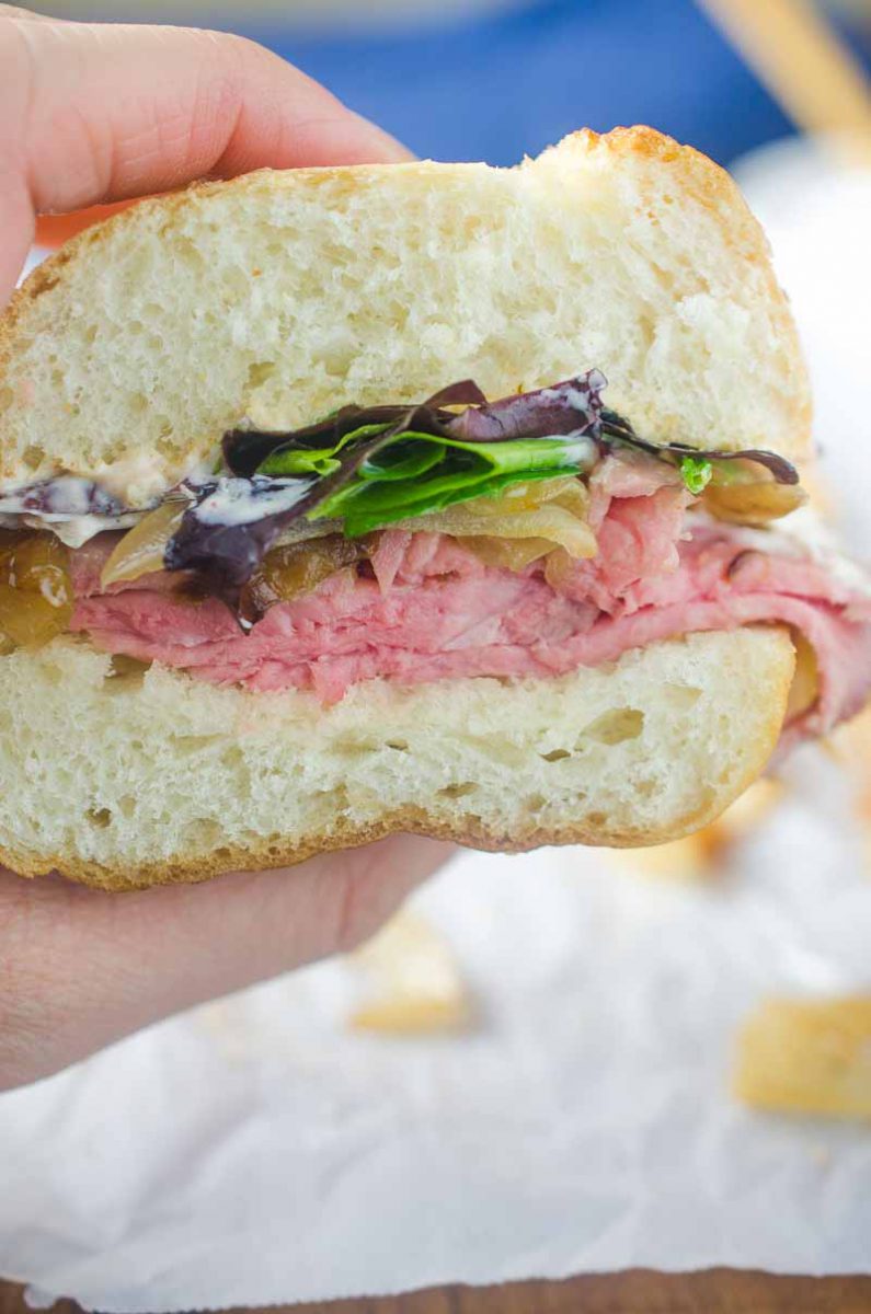 The Best Roast Beef Sandwich loaded with thinly sliced roast beef, caramelized onions, lettuce and a creamy horseradish sauce.
