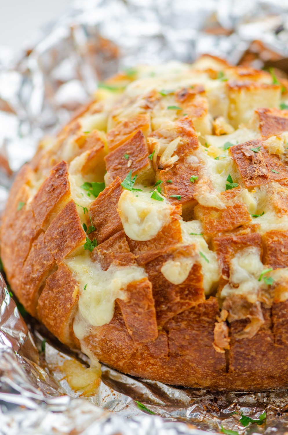 Roasted Garlic pull  apart bread on aluminum foil. 