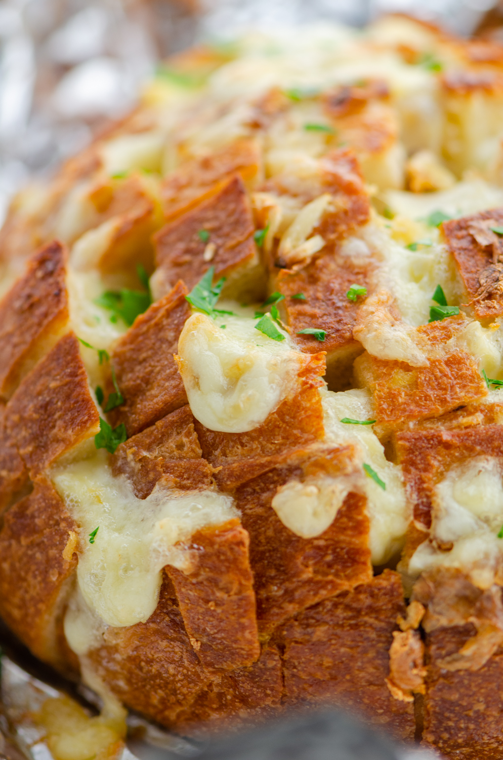 Close up of cheese melting out of bread. 