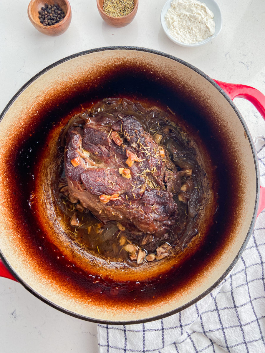 Slow cooked pot roast in dutch oven. 