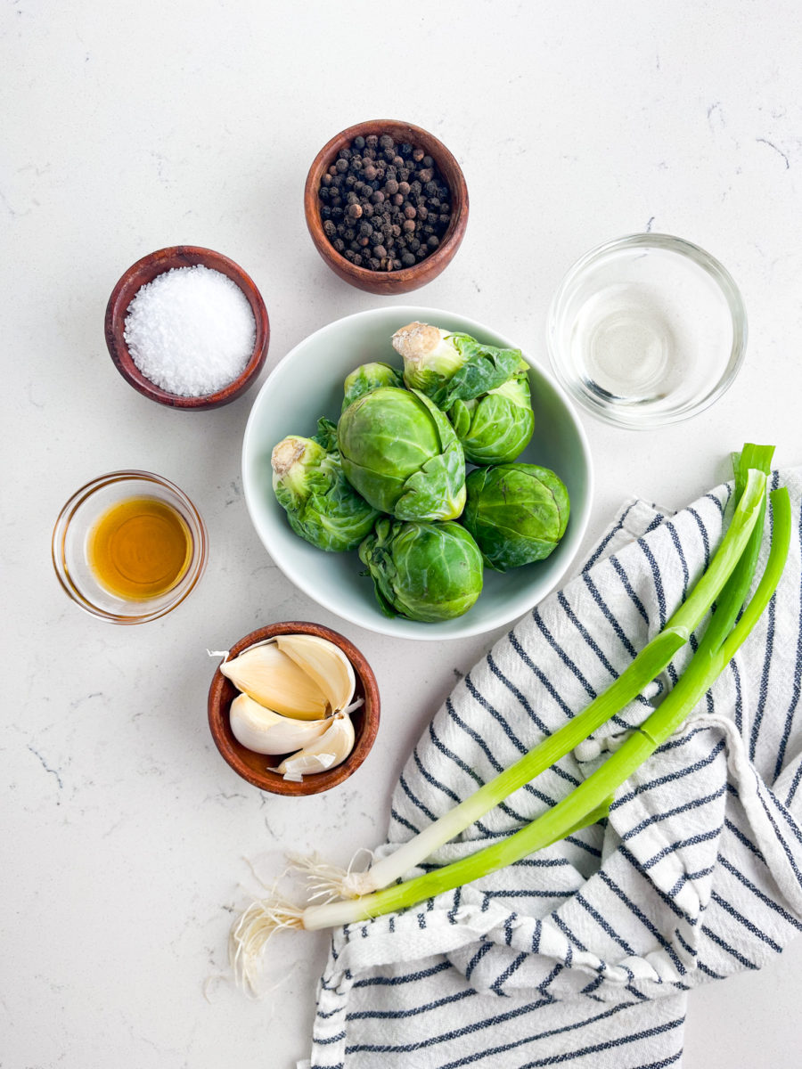 Salt and pepper brussels sprouts ingredients on white background. 