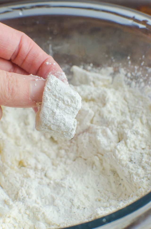 A piece of calamari dredged in flour/cornstarch. 