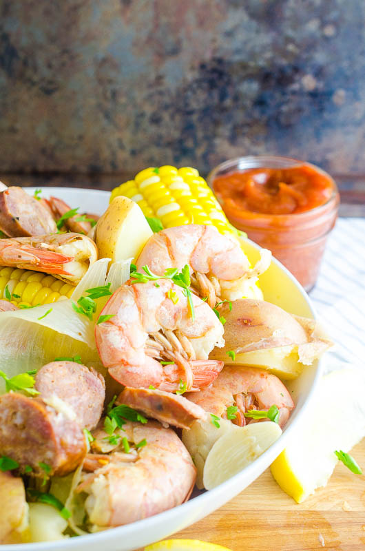 An easy shrimp boil recipe with shrimp, sweet corn, spicy andouille, and red potatoes. It's great for a crowd! 
