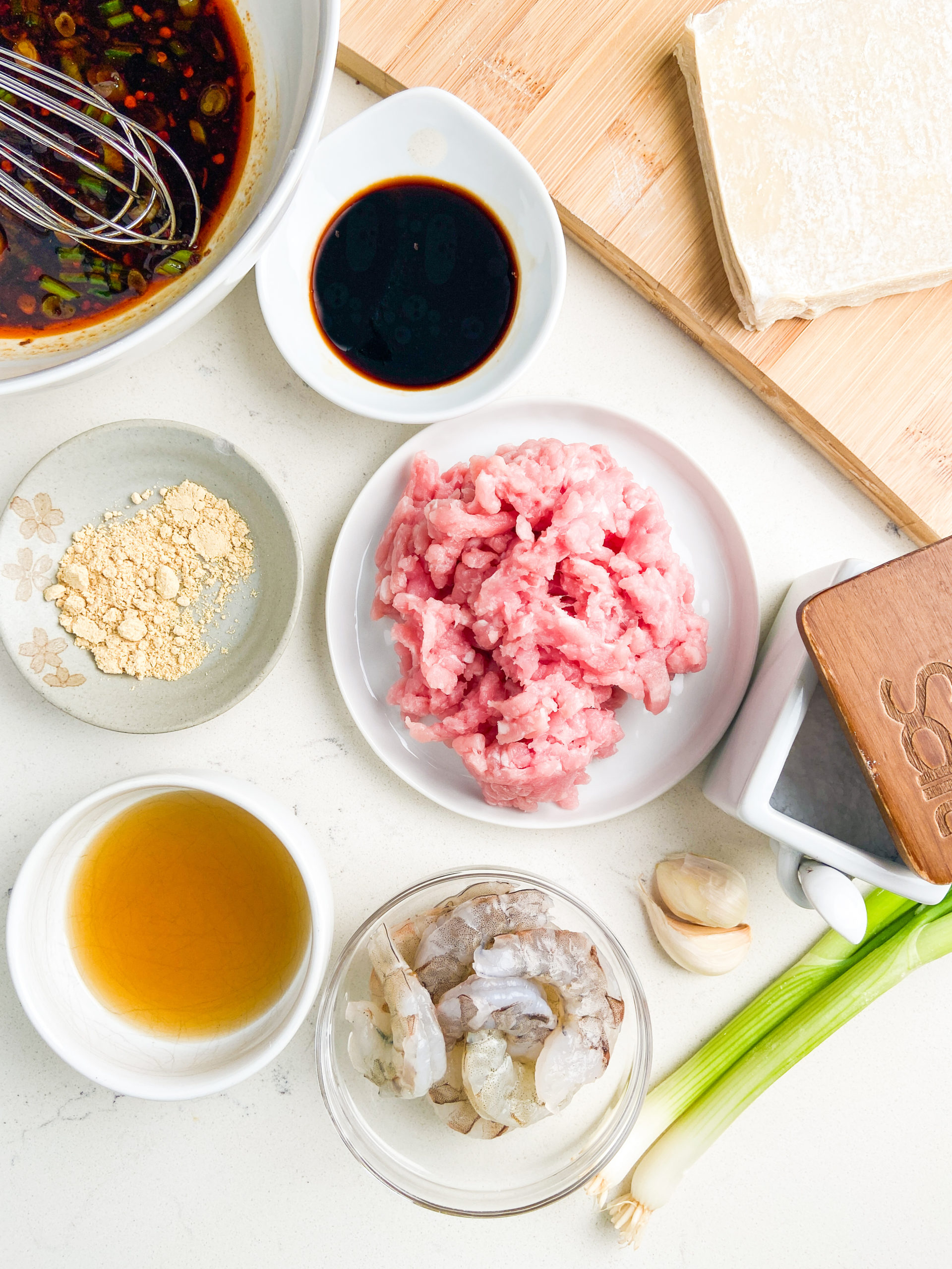 Overhead photo of ingredients needed to make spicy shrimp and pork dumplings