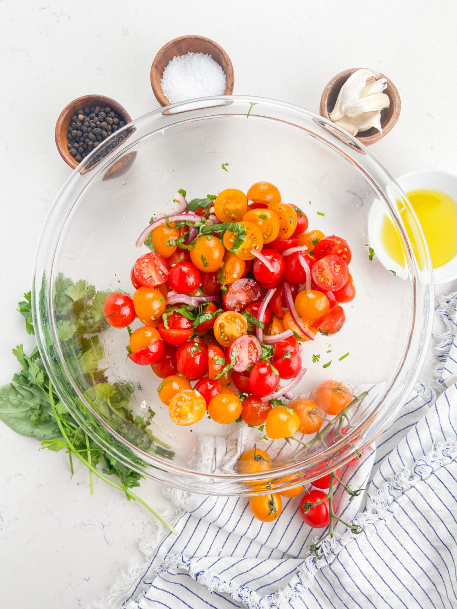 Summer tomato salad in glass bowl. 