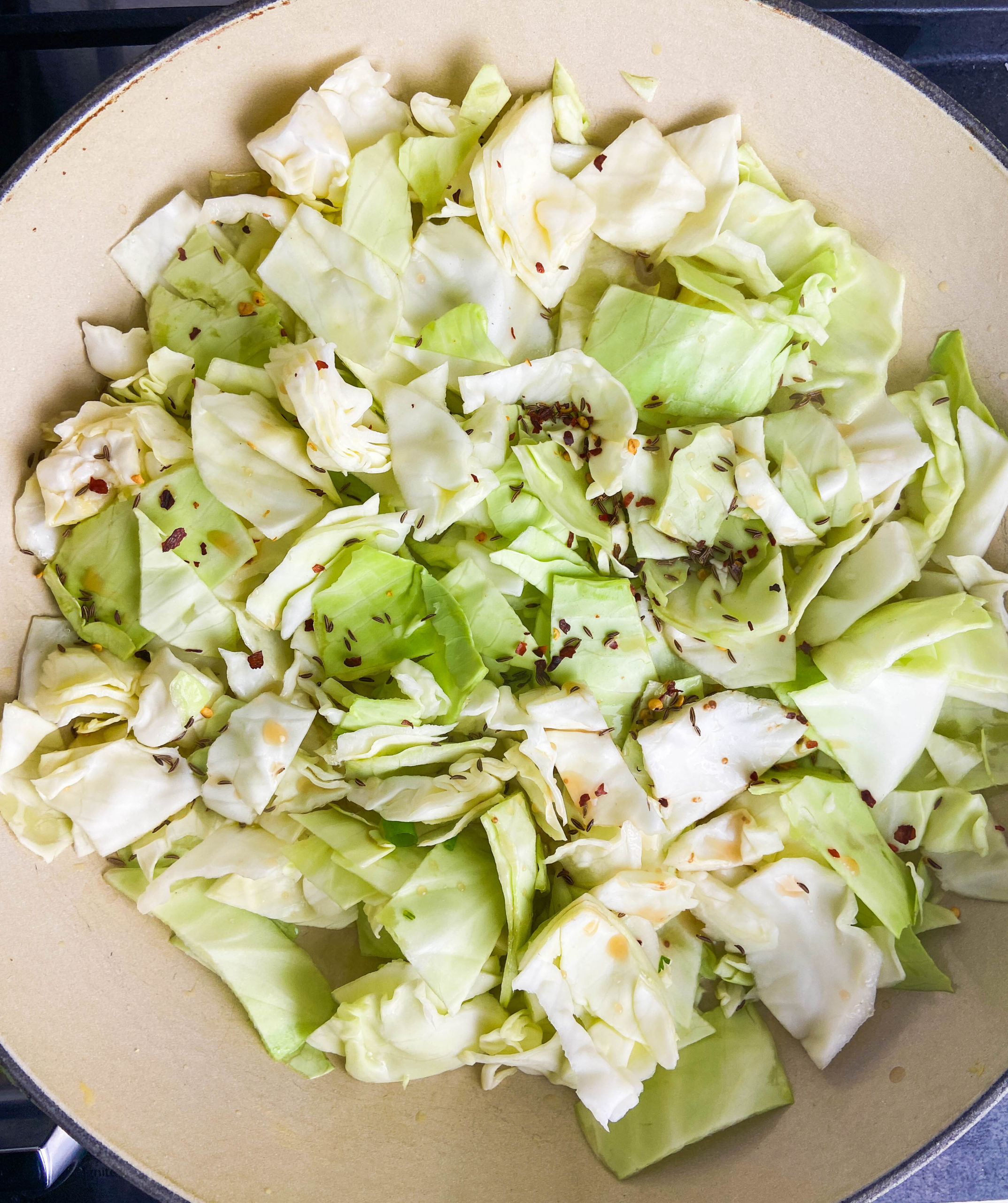 Sauteed cabbage in a pan. 