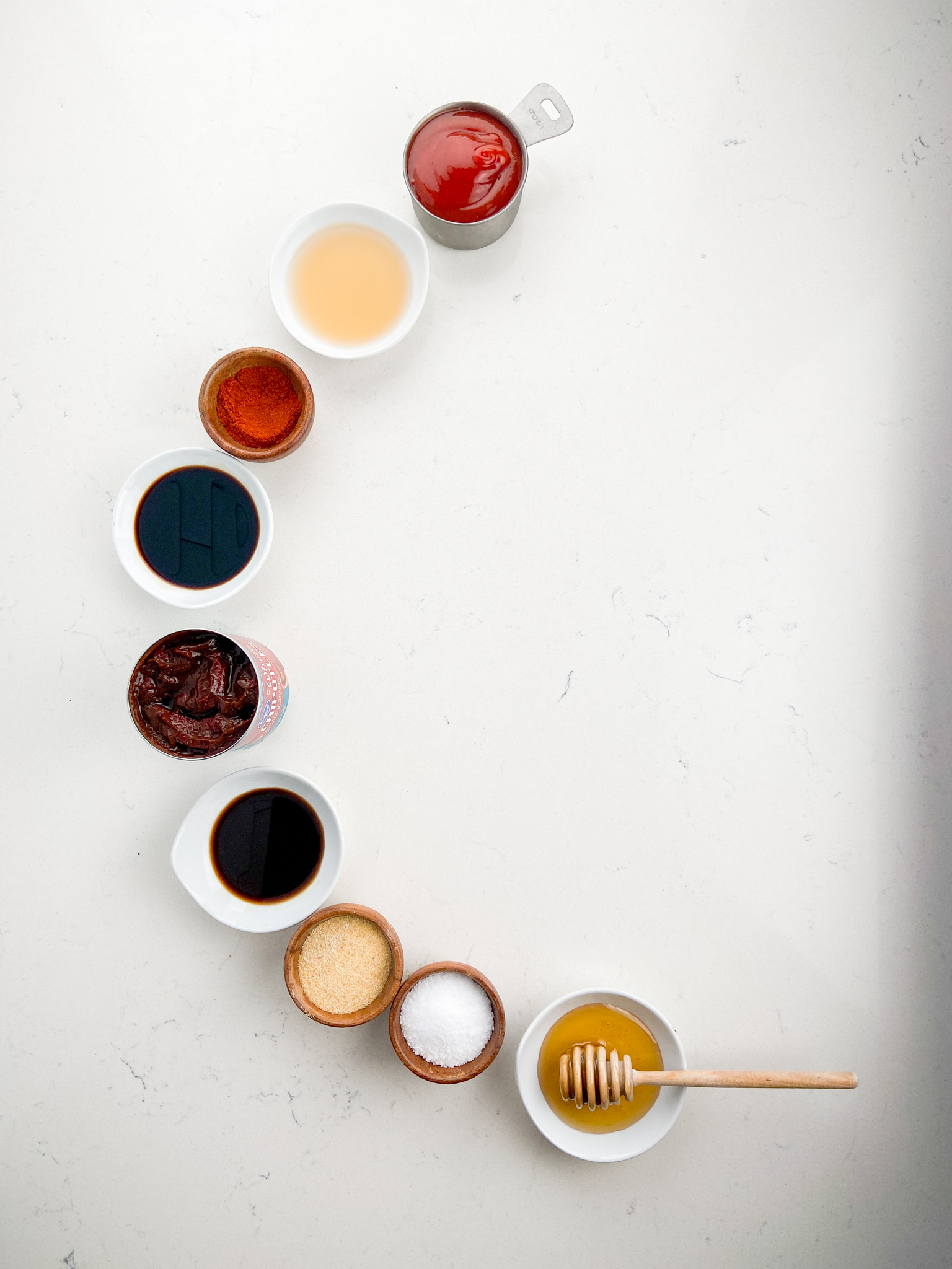 Overhead photo of Chipotle BBQ Sauce ingredients on white background. 