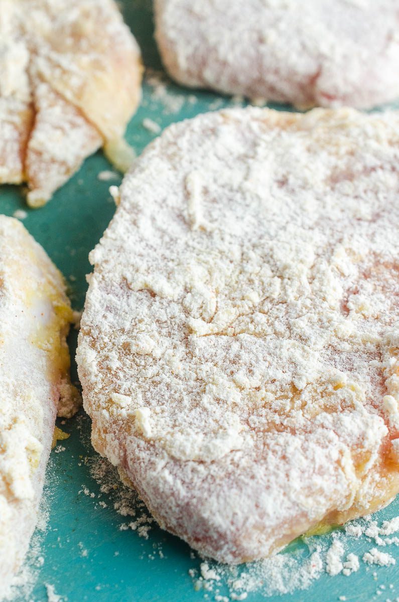 Let seasoned flour set on pork chops so that the breading sticks better. 