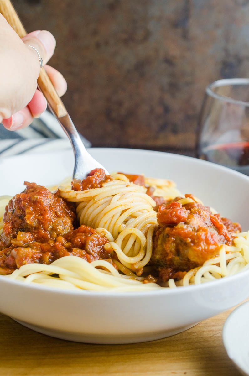 Spaghetti and Meatballs is a comfort food classic and the ultimate family friendly food. With this spaghetti and meatballs recipe learn how to make tender, juicy meatballs and finish them in a savory homemade marinara sauce. 