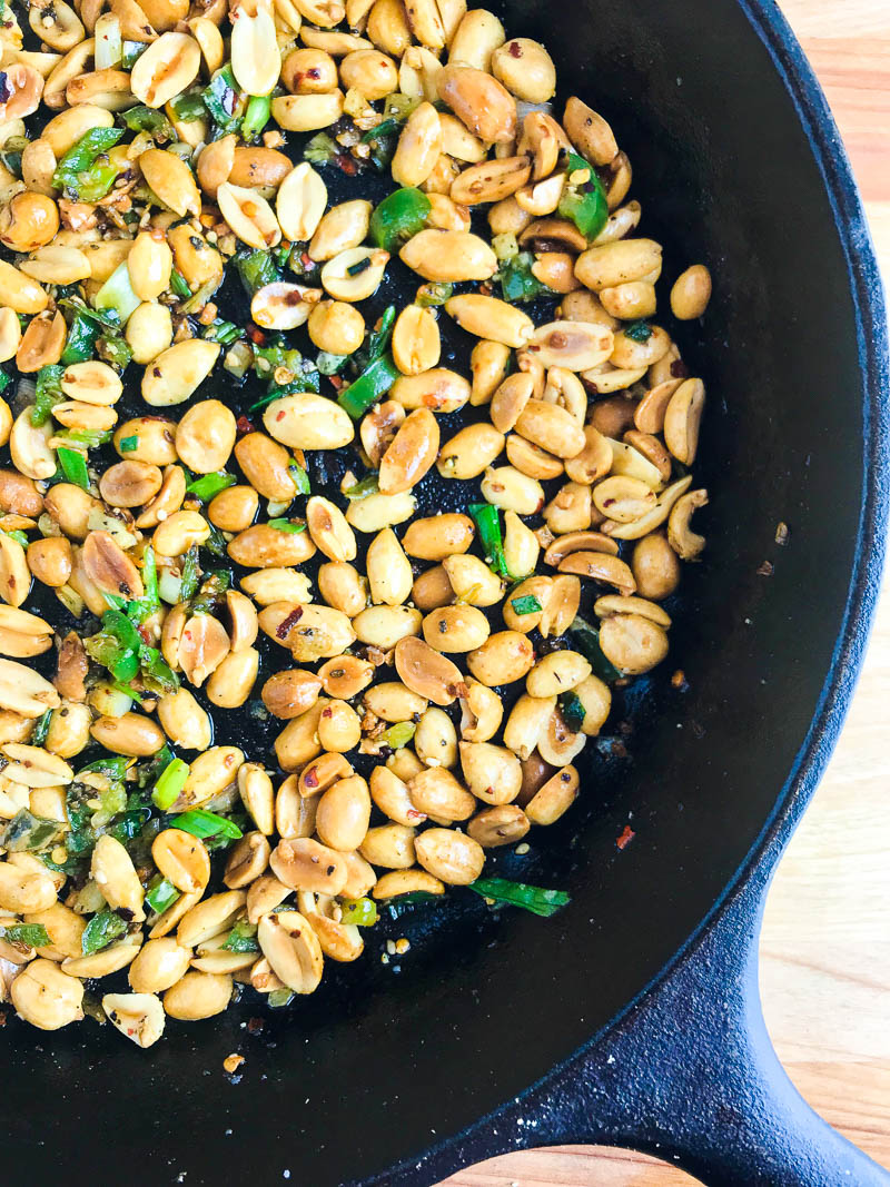 Spicy Fried Peanuts are your new favorite snack! These peanuts are fried in hot oil, sesame oil, garlic, Serrano peppers and crushed red peppers. A little heat and a whole lot of flavor! 