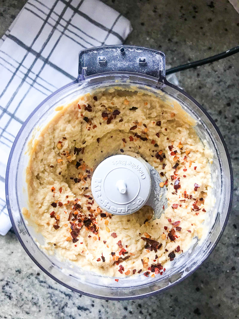 A kicked up version of traditional hummus with lime, crushed red pepper and cayenne. Spicy Hummus is a great addition to your party dip spread. 