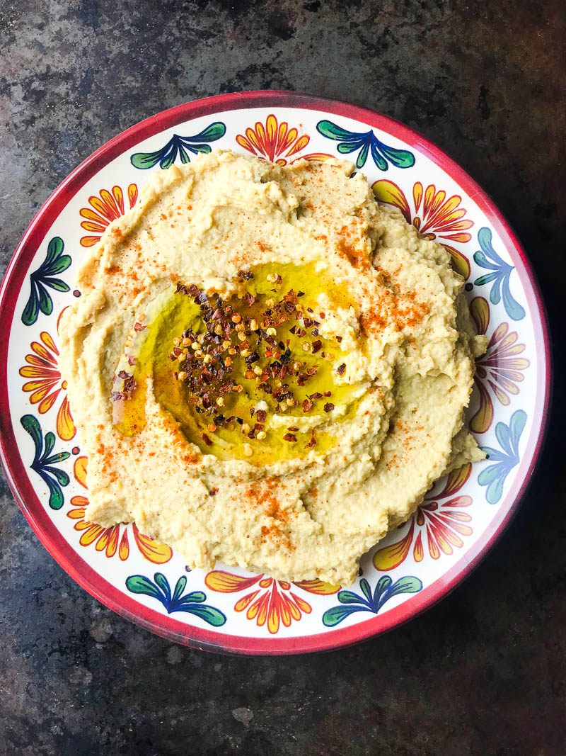 A kicked up version of traditional hummus with lime, crushed red pepper and cayenne. Spicy Hummus is a great addition to your party dip spread. 