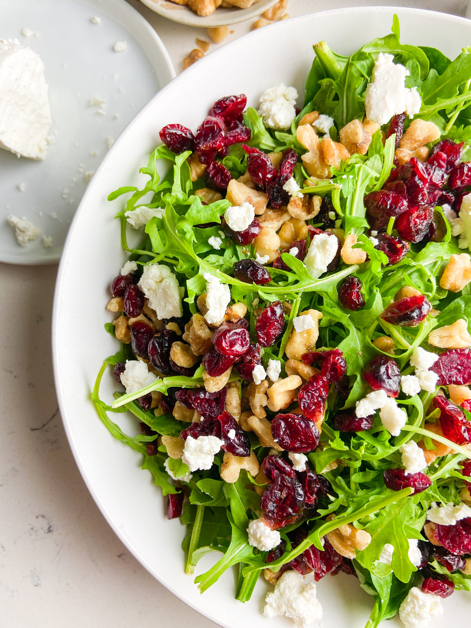 Overhead photo of spinach cranberry salad up close. 