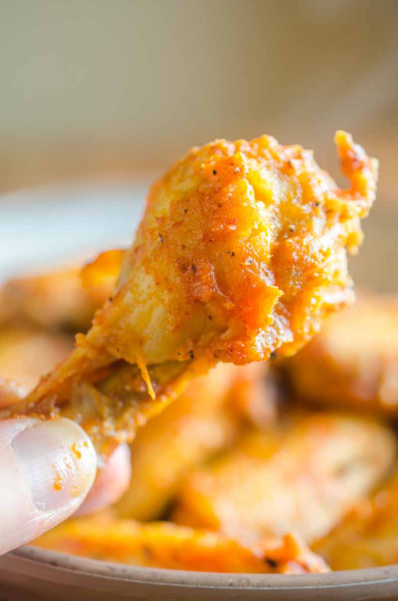 Sriracha Chicken Wings are baked to perfection and then tossed in a spicy sriracha sauce. They will be your new favorite chicken wing!