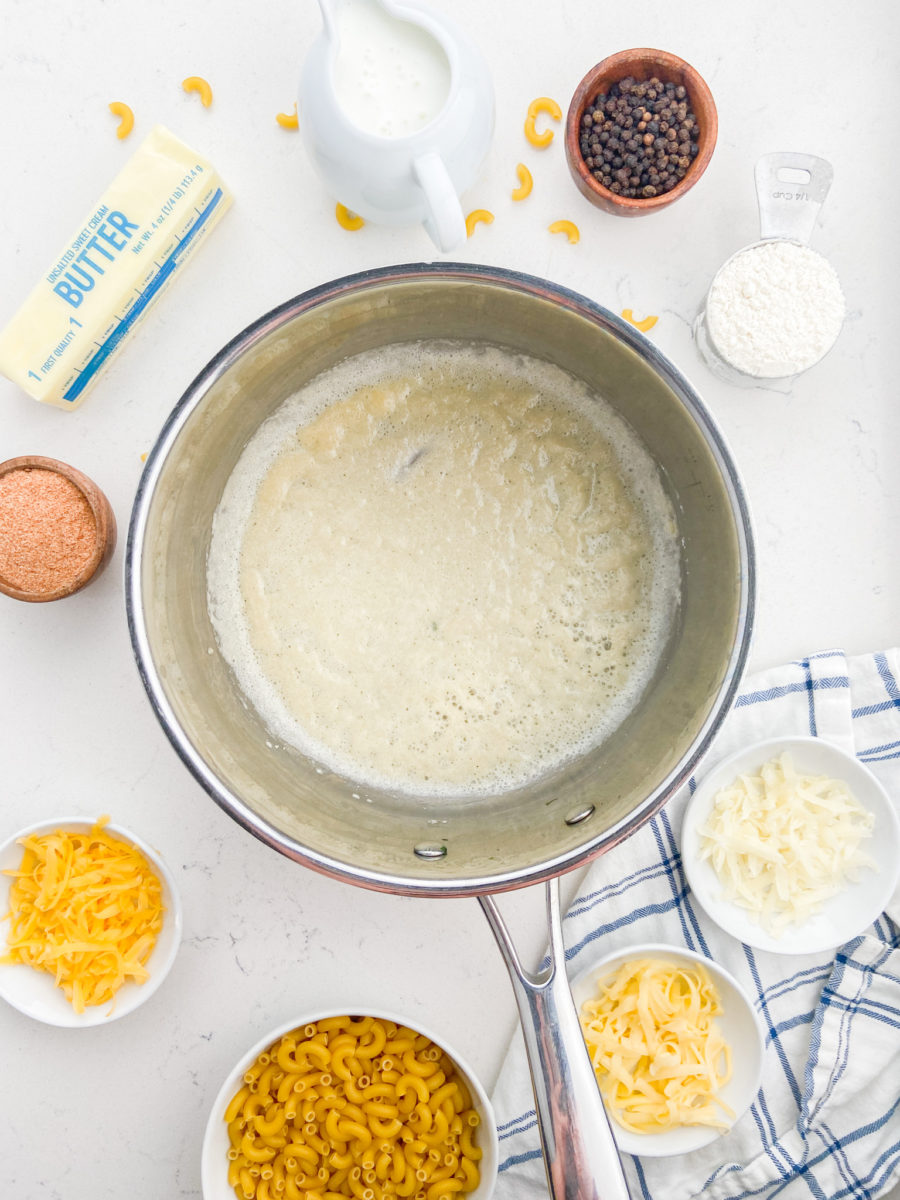 Cooking flour and butter in stainless steel pot. 