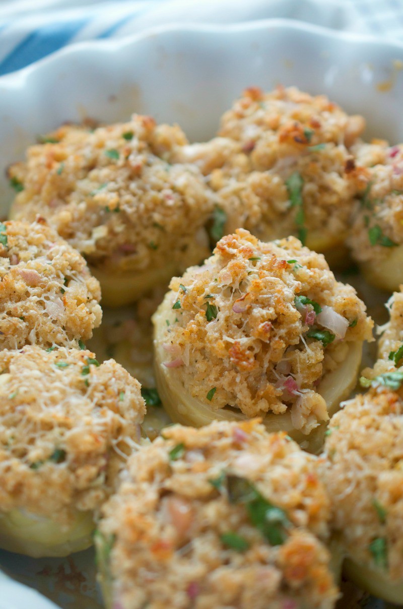 These stuffed artichoke bottoms are stuffed with parmesan, chopped clams, shallots and breadcrumbs. They are the perfect bite for holiday parties!