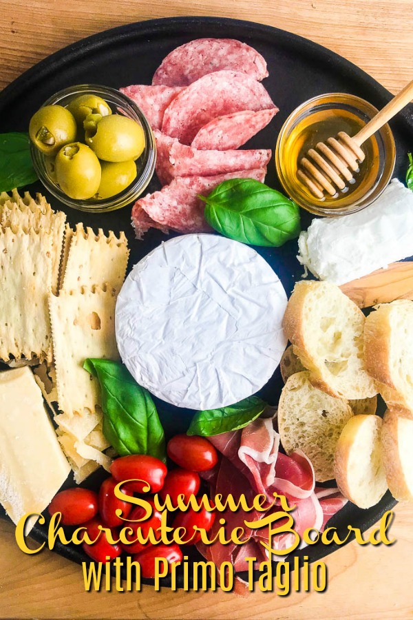 This Summer Charcuterie Board is loaded with 3 different kinds of cheese, meat, olives, tomatoes, crackers and sweet honey. It's perfect for all of your snacking this summer.  #ad #charcuterieboard