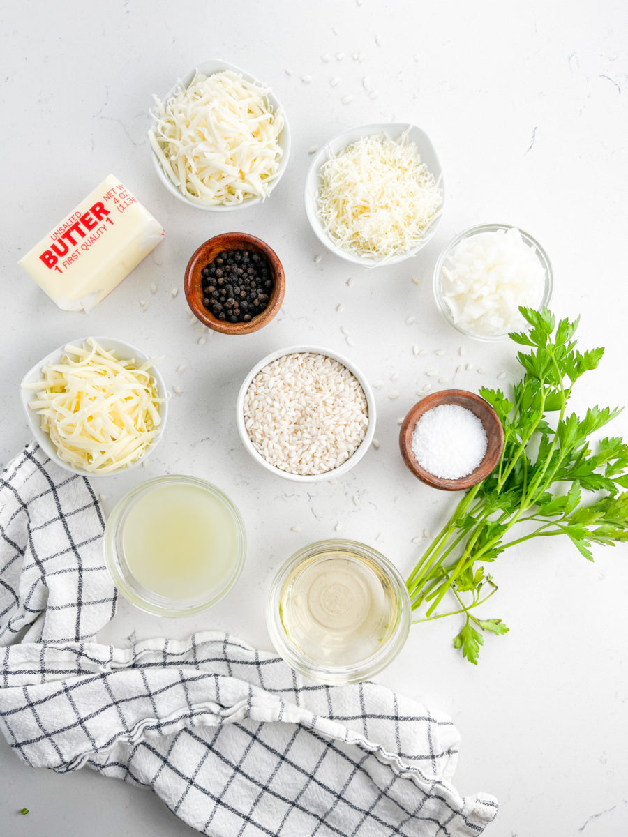 Three cheese risotto ingredients on white background. 