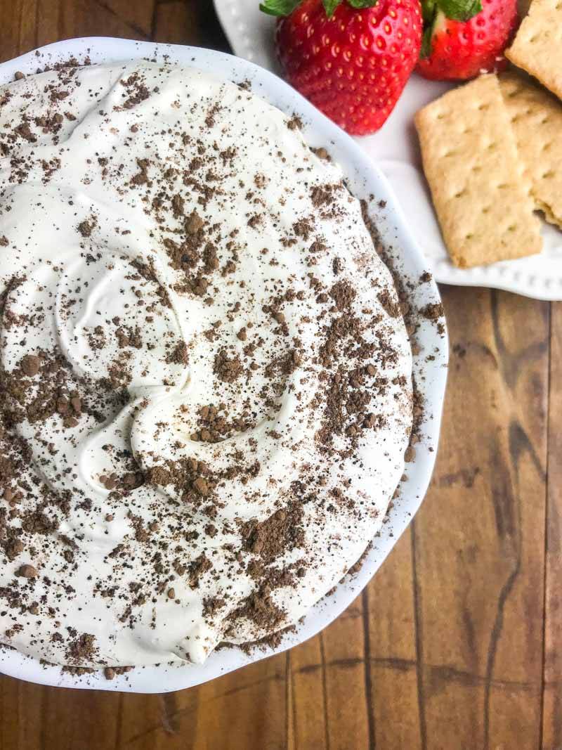 If you are looking for a quick and easy dessert, this Tiramisu Cheesecake Dip is it. It's a creamy, dreamy downright decadent dessert dip for graham crackers and fresh fruit. 