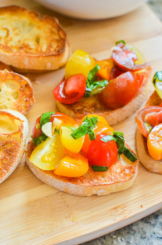 Tomato Bruschetta on wooden cutting board