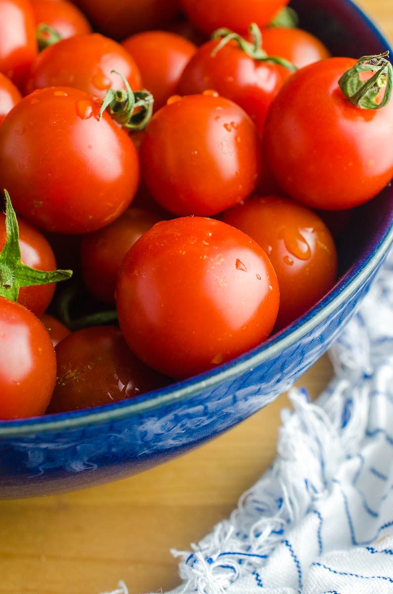 A bowl full of fresh summer tomatoes