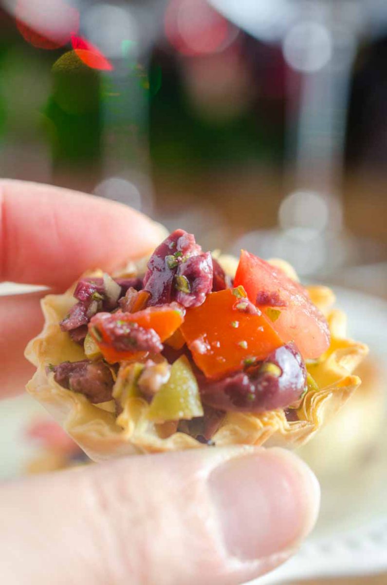 Tomato Olive Phyllo Cups are the perfect party appetizer. Fresh tomatoes and briny olives piled high in crispy phyllo cups. Ready in less than 10 minutes! 