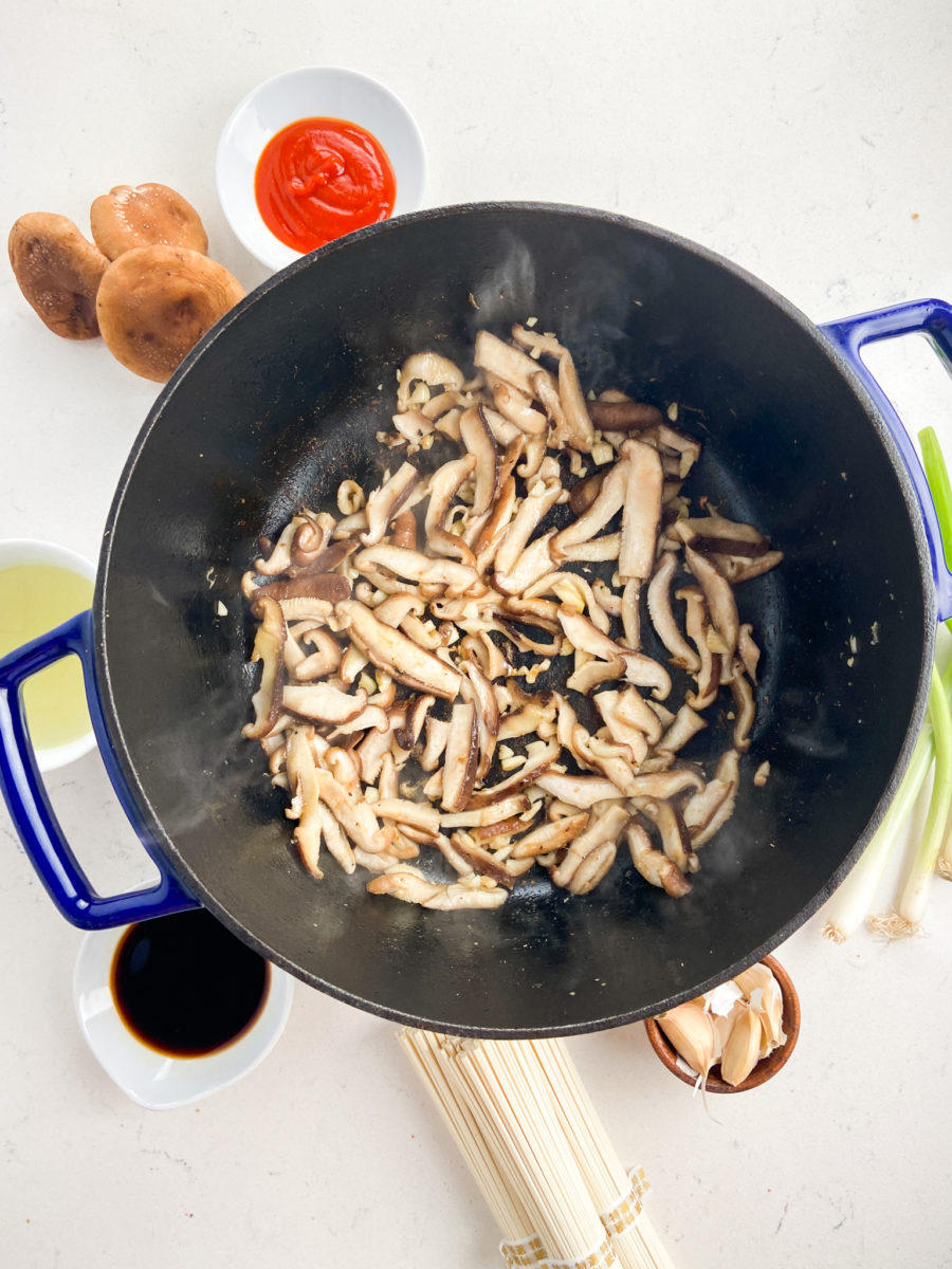 Sautéed shiitake mushrooms in pot. 