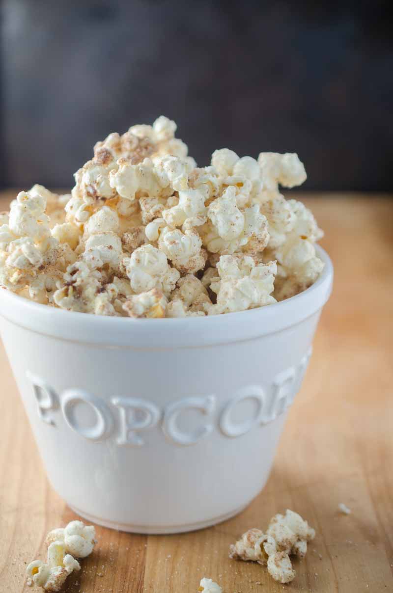 Everyone's favorite theme park treat gets turned into a popcorn snack with this churro popcorn loaded with cinnamon, sugar and white chocolate.