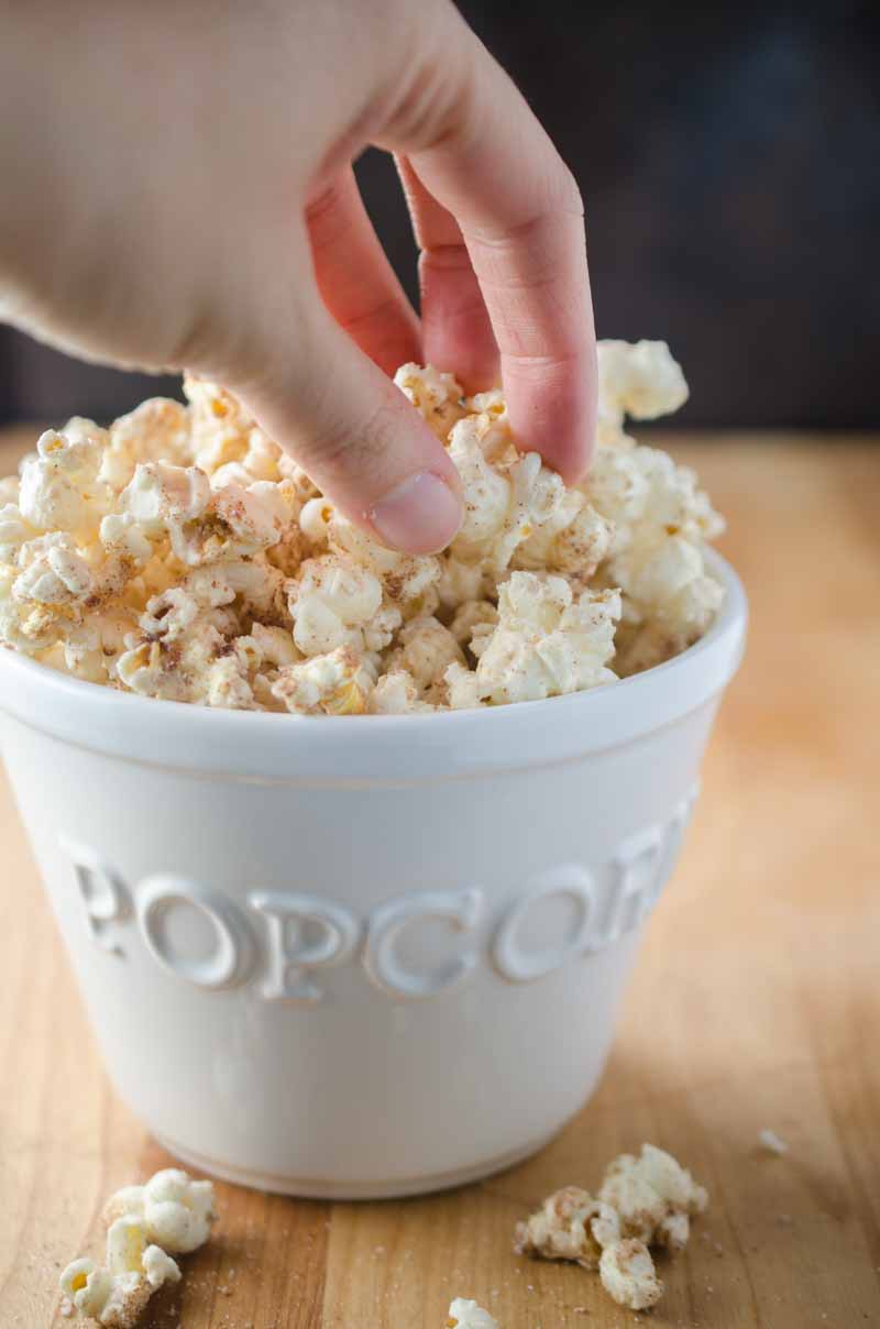 Everyone's favorite theme park treat gets turned into a popcorn snack with this churro popcorn loaded with cinnamon, sugar and white chocolate.