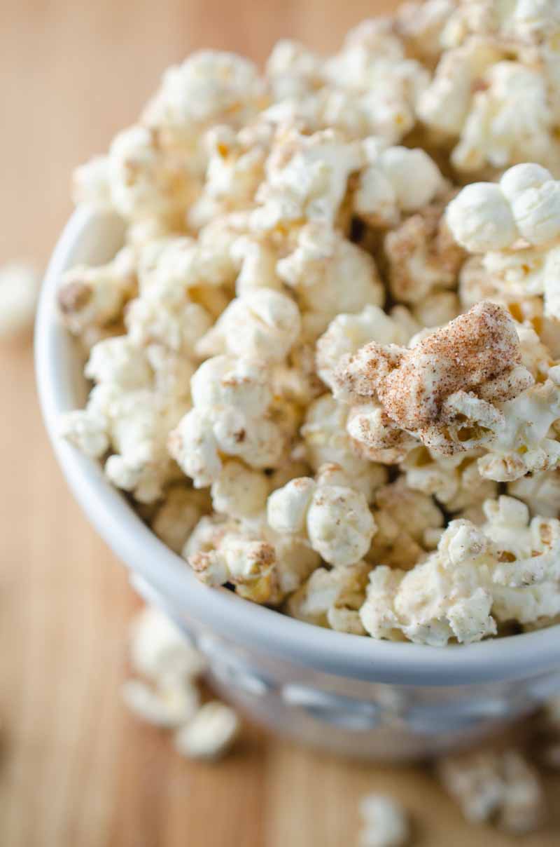 Everyone's favorite theme park treat gets turned into a popcorn snack with this churro popcorn loaded with cinnamon, sugar and white chocolate.
