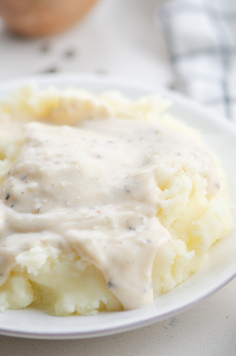 White country gravy on mashed potatoes. 