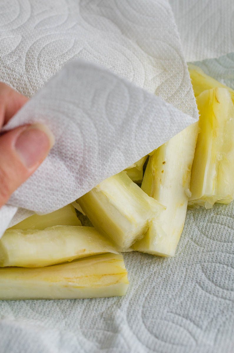 Pat dry boiled yuca root with paper towel