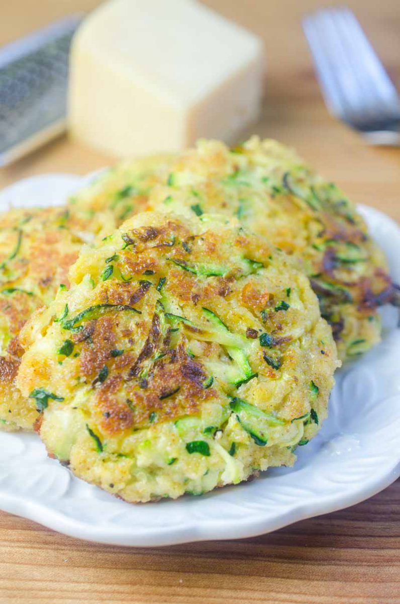 Zucchini cakes made with fresh zucchini, cheese, and spices blended together and fried until golden. A great way to use up that garden zucchini!